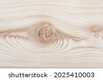 Background texture. Surface of a larch edged board with knot on cut. Wood texture. Top view, copy space.