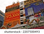Small photo of BANGKOK, THAILAND - July 2012. Beautiful Buddhist temple Wat Suan Phlu (Bang Rak district, Charoen Krung Alley) with skyscraper and advertisements in the background. Sacrum and profane in architecture
