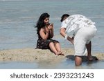 Small photo of NEIL (Shaheed Dweep - Andaman Islands), INDIA - November 26, 2023. Indian tourists on the Bharatpur beach. At low tide in the Andaman Sea. Adjacent to the harbor on Neil Island.