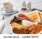 Traditional Full English Breakfast With Toast And Tea 