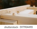 Small photo of Assembling furniture, wooden dowel joint