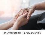 Parkinson disease patient, Alzheimer elderly senior, Arthritis person's hand in support of nursing family caregiver care for disability awareness day, National care givers month, ageing society 