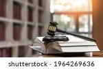 Law, legal judgement, legistration, litigation, court verdict, judicial system and civil right and social justice concept with judge gavel on law textbook in attorney law firm, lawyer business office