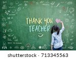 Thank You Teacher greeting card for World teacher's day concept with school student back view drawing doodle of of learning education graphic freehand illustration icon on green chalkboard