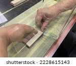 Drive heated plexiglass with your hands. Production of a form for an advertising stand. Plastic bending on a nichrome heated spiral. Production of POS materials for advertising.