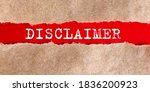 Small photo of DISCLAIMER appearing behind torn paper.Business