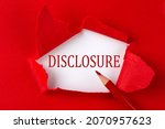 Small photo of DISCLOSURE text on red torn paper with red pencil