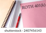 Small photo of ROTH 401K word on pink paper with office tools on white background