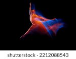 Small photo of Feelings and emotions. Young graceful and flexible shirtless male ballet dancer dancing isolated on dark background in glowing colorful neon light. Grace, art, beauty, contemp dance concept.