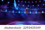 Small photo of Scoring winning goal. Young man, professional basketball player in yellow uniform jumping, throwing ball into basket on 3D stadium with flashlights. Concept of sport, competition, action and motion