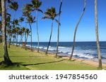 Small photo of Lauro de Freitas, Bahia, Brazil - 03 29 2021: The beach of Vilas do Atlantico is famous for promenade and sidewalk that is present all along the edge of the place. Tourists love cycling and surf