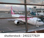 Small photo of Toronto, Ontario, Canada - 11-19-2023: Westjet Swoop airline at Pearson International Airport in Ontario, Canada