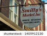Small photo of Lockhart, Texas - May 23 2019: A sign for the popular Smitty's Market barbecue