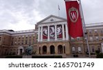 Small photo of Madison, WI - May 24, 2022: Bascom Hall with logo banner at University of Wisconsin Badgers' college campus building