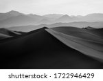 Black & White Image of Mesquite Flat Sand Dunes and Desert with Mountains in the Distance, located in Death Valley National Park in California