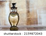 Figurine Of An Owl On The...