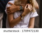 Close-up of couple hands. Well dressed stylish man and woman wearing wristwatches.