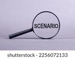 Small photo of Magnifier with SCENARIO text on gray background