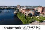 Small photo of Grand Rapids, Michigan, USA - June 17, 2023: Aerial view of the Grand Rapids Public Museum on the bank of the Grand River in downtown Grand Rapids