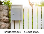 Post Box On White Wooden Fence. ...