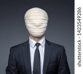 Small photo of Businessman with an elastic bandage on his head