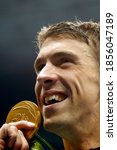 Small photo of Rio de Janeiro, Brazil 08/09/2016: Michael Phelps gold medal at Rio 2016 Olympic Games 200m butterfly swim portrait. USA champion record holder swimmer wins swimming competition at Aquatic Stadium