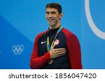 Small photo of Rio de Janeiro, Brazil 08/09/2016: Michael Phelps gold medal at Rio 2016 Olympic Games 200m butterfly swim portrait. USA champion record holder swimmer wins swimming competition at Aquatic Stadium