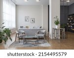 Small photo of minimalist modern interior design huge bright apartment with an open plan in Scandinavian style in white, blue and dark blue colors with columns in the center. includes kitchen area, office and lounge