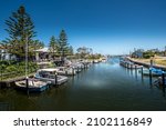 Small photo of Mordialloc, Victoria, Australia - December 2021: Small boats on Mordialloc Creek in Melbourne's bayside, with the Bridge Hotel on left.