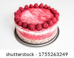 Homemade raspberry raw cake on a tin tray