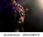 edited image of laughing buddha idol with abstract and glow lightspeaceful smiling buddha statue with focus on subjectbackground image of laughing buddhaisolated face of a smiling buddha statue