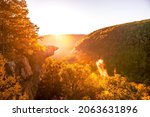 Sunrise at Whitaker Point, known as Hawksbill Crag, during the fall color change of the leaves. Hawksbill is a popular tourist site in the state of Arkansas.