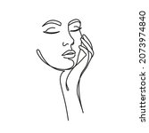 woman's face in one line art... | Shutterstock .eps vector #2073974840