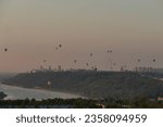 Small photo of Nizhny Novgorod, Russia, 08.17.2023. Aeronautics Festival. City Day in Nizhny Novgorod 2023. Nizhny Novgorod 802 , the capital of sunsets. Balloons in the sky above the city.