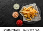 tasty french fries potatoes on... | Shutterstock . vector #1689495766
