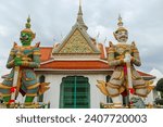 Small photo of Wat Arun is a Buddhist temple in Bangkok Yai district of Bangkok, Thailand. Wat Arun is one of famous landmark Temple at sunset in bangkok Thailand. Giants front of the church at Wat Arun.
