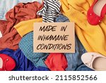 Fast fashion background with pile of cheap, low quality clothes. Garment made in unjust, inhumane conditions idea. Environmental impact, carbon emissions concept