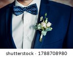 stylish boutonniere on the groom's jacket, wedding day, beautiful flower boutonniere, wedding concept
