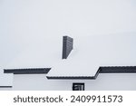 Small photo of Chimney, chimney on the roof of the house, metal chimney, snow on the roof, country house. High quality photo