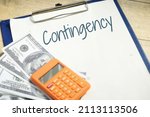 Small photo of Contingency wording with calculator and fake money. Financial concept