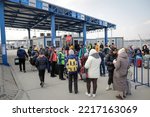 Small photo of Isaccea, Romania - March 3, 2022: Ukrainian refugees, mostly women and children, at the border crossing with Romania after fleeing the war in Ukraine.