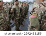 Small photo of Bucharest, Romania - April 5, 2023: Servicemen of the 10th Mountain Division and of the 101st Airborne Division Air Assault, both of the US Army, attend the transfer of authority ceremony between the