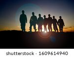 silhouette of oilfield workers... | Shutterstock . vector #1609614940