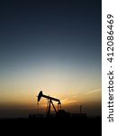 Sunset And Silhouette Of Crude...
