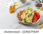 Small photo of Cobb salad with bacon, avocado, tomato, grilled chicken, eggs isolated on white background. American salad. Healthy food. Copy space.