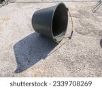 Small photo of A bucket is a container or container usually in the form of a watertight cylinder, vertical cylinder or truncated cone or square, with an open top and a flat bottom, mounted on a semicircular handle c