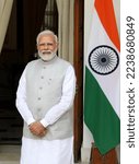 Small photo of New Delhi, India, Dec 16, 2022 : Indian Prime Minister Narendra Modi seen as Indian National Flag seen in the background