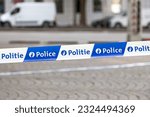 Small photo of Brussels, Belgium - July 02 2019: Close-up on a bilingual (french and dutch) police tape.