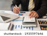  Businessmen are calculating income-expenditure and analyzing real estate investment data, Accounting Financial and tax systems concept.