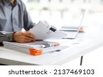 Small photo of Business Documents, Auditor businesswoman checking searching document legal prepare paperwork or report for analysis TAX time,accountant Documents data contract partner deal in workplace office